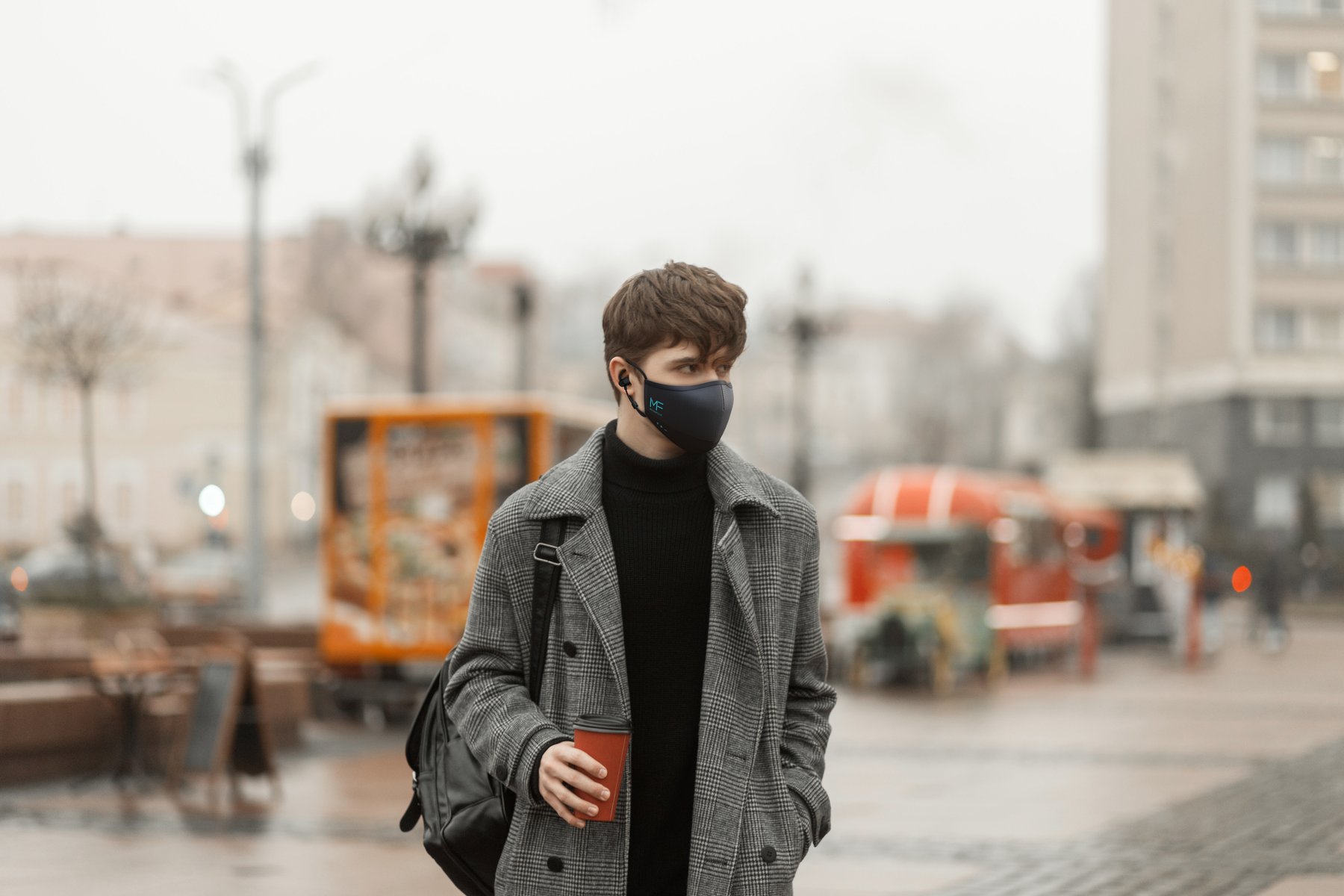 Person wearing MaskFone in the city